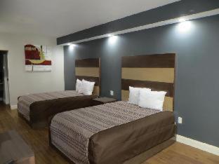 Grand Villa Inn & Suites Chinatown Хюстън Стая снимка