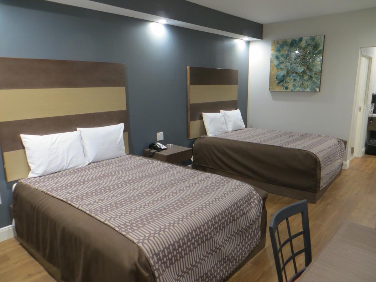 Grand Villa Inn & Suites Chinatown Хюстън Екстериор снимка